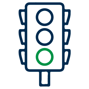 Icono que representa un semáforo con tres círculos, donde el círculo inferior está iluminado en verde.
